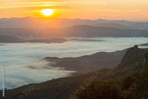 The beautiful sunrise over the mountains range in Doi Samer Dao national park of Nan province of Thailand. © boyloso