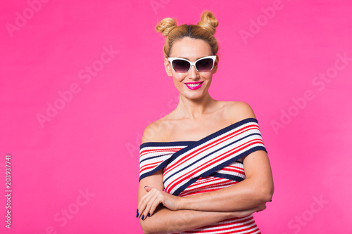 Beauty surprised fashion funny model girl wearing sunglasses. Expressing positive emotions, smile. Beautiful woman with copyspace