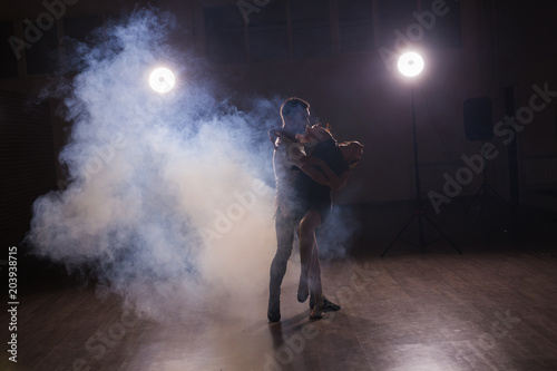 Active happy adults dancing bachata together in dance class © satura_