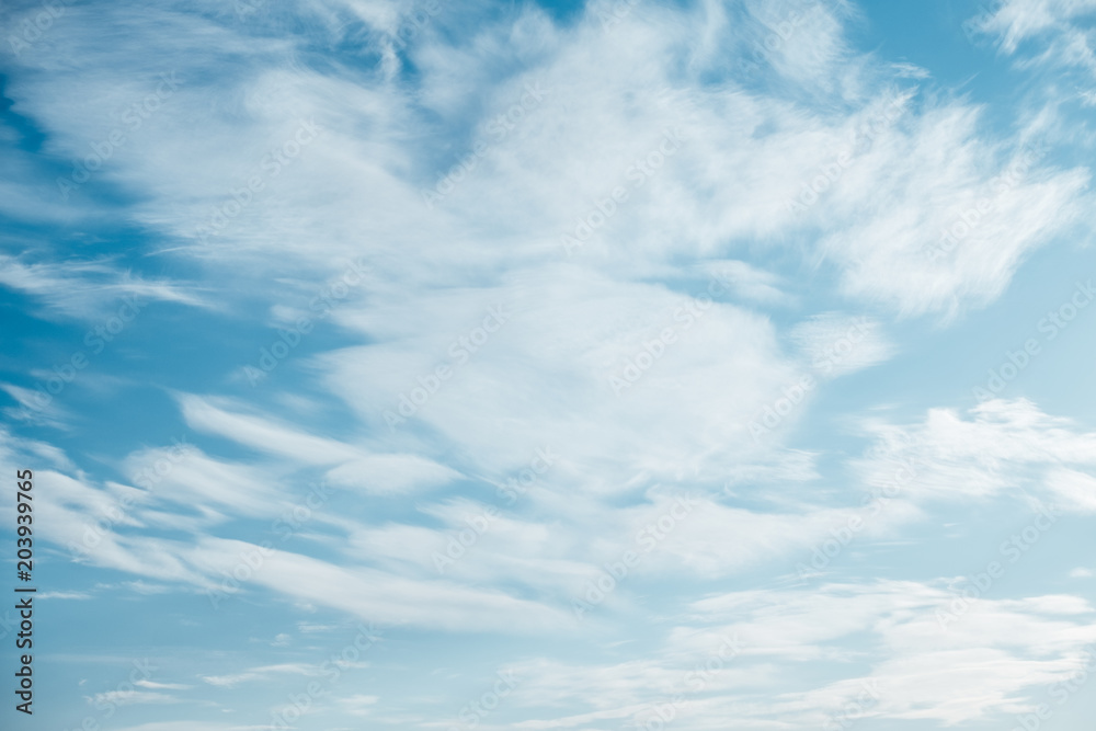White fluffy clouds in the blue sky White fluffy clouds in the blue sky