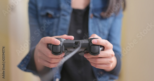 Woman playing game on console