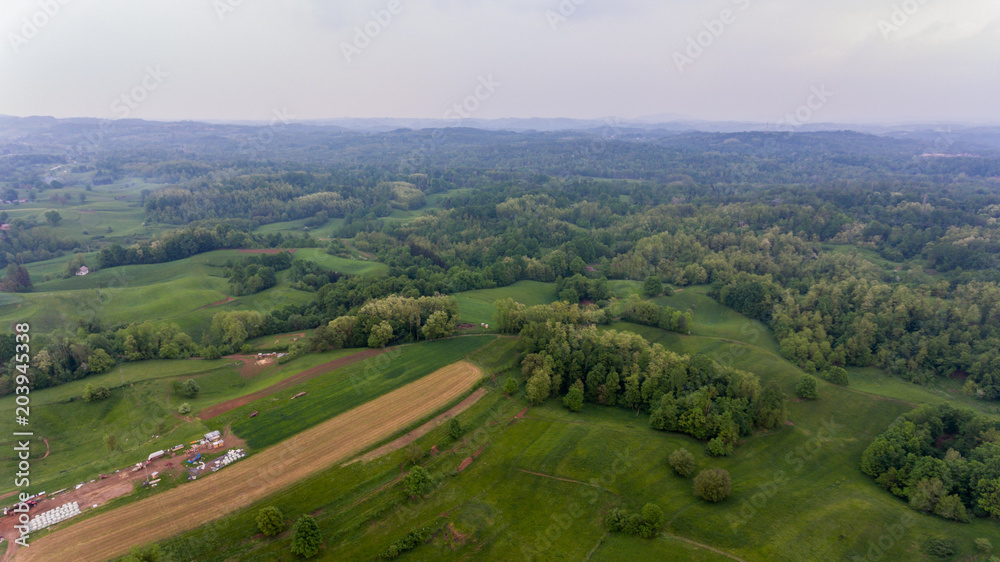 Aerial view of countryside at sunset.