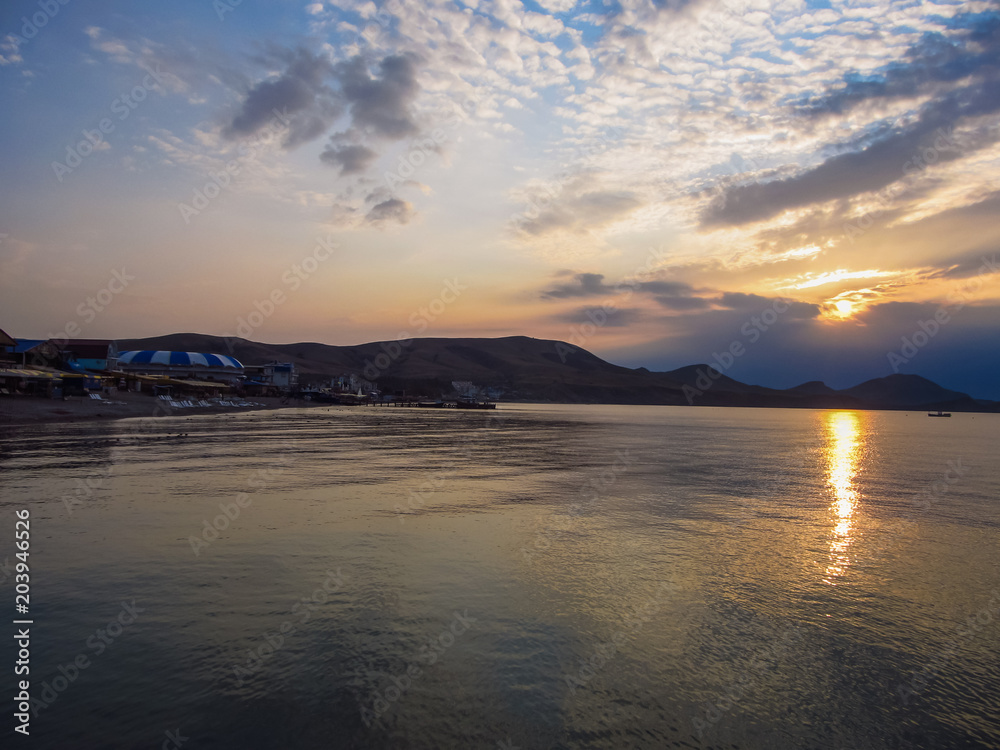 Sunset. Solar path on the sea water. Cape Hamelion. Crimea