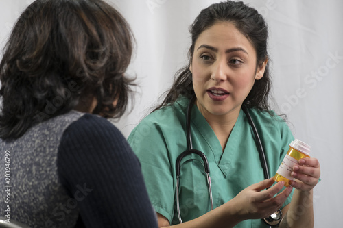 Patient receiving prescription drug instructions from health professional