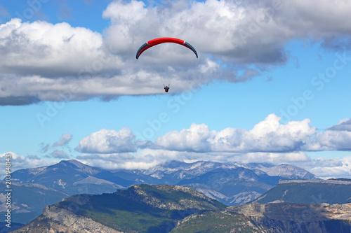Paraglider flying in the French Alps