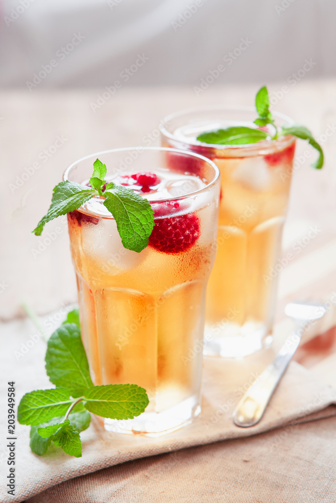 Refreshing summer drink with raspberry, mint and ice copy space Refreshing summer drink with raspberry, mint and ice copy space