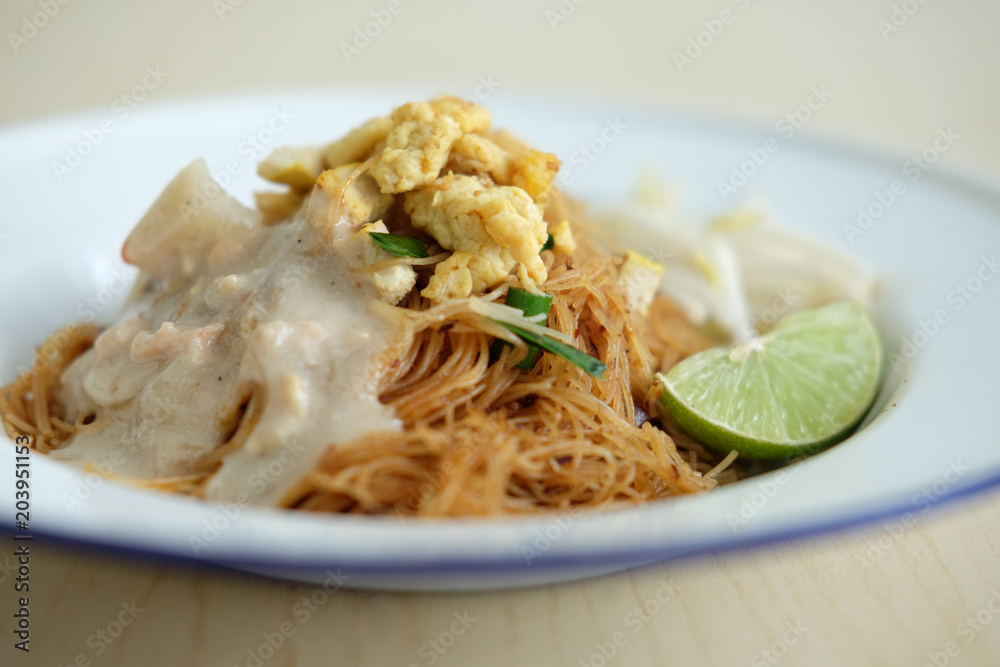 COCONUT RICE NOODLE
Stir fried coconut rice noodle served with vegetable and coconut sauce. Popular thai street food. COCONUT RICE NOODLE
Stir fried coconut rice noodle served with vegetable and coconut sauce. Popular thai street food.
