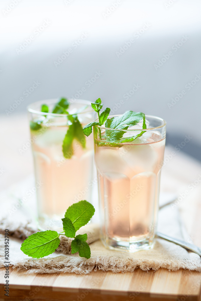 Refreshing summer drink with lemon, mint and ice copy space Refreshing summer drink with lemon, mint and ice copy space