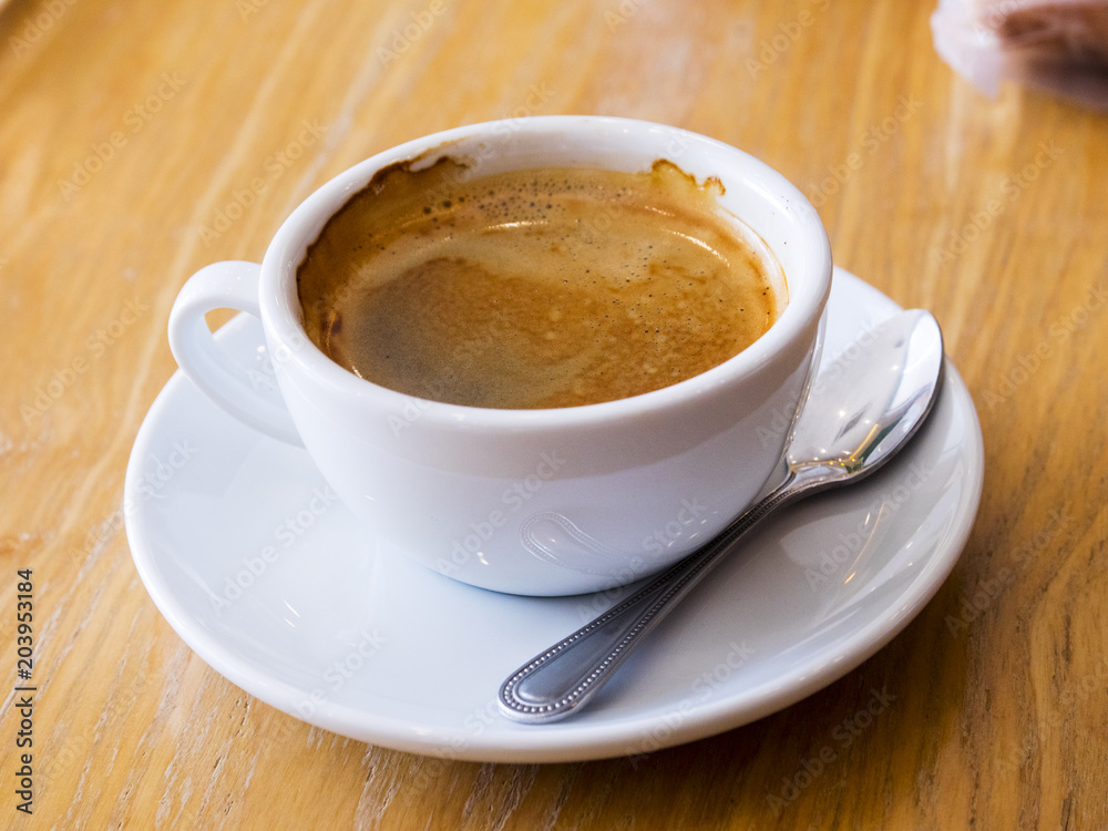 White Coffee Cup in brown background White Coffee Cup in brown background
