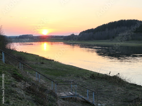 spring river in the evening at sunset