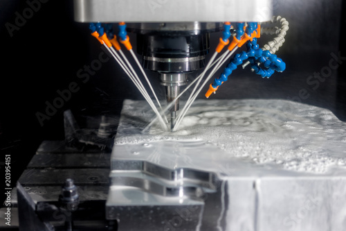 High precision CNC machining center working, operator machining automotive sample part process