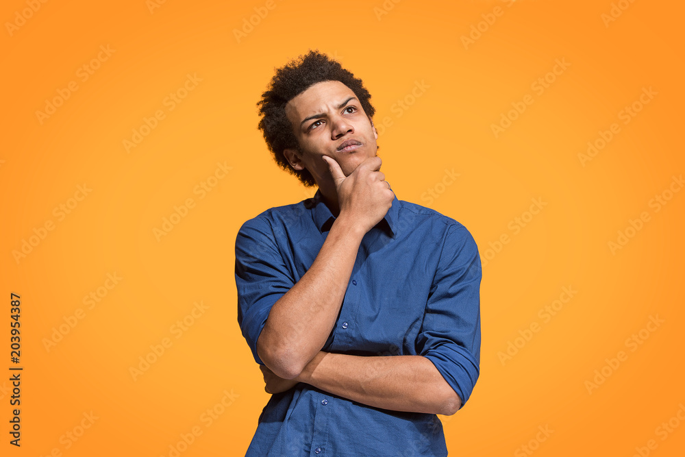 Young serious thoughtful businessman. Doubt concept. Young serious thoughtful businessman. Doubt concept.