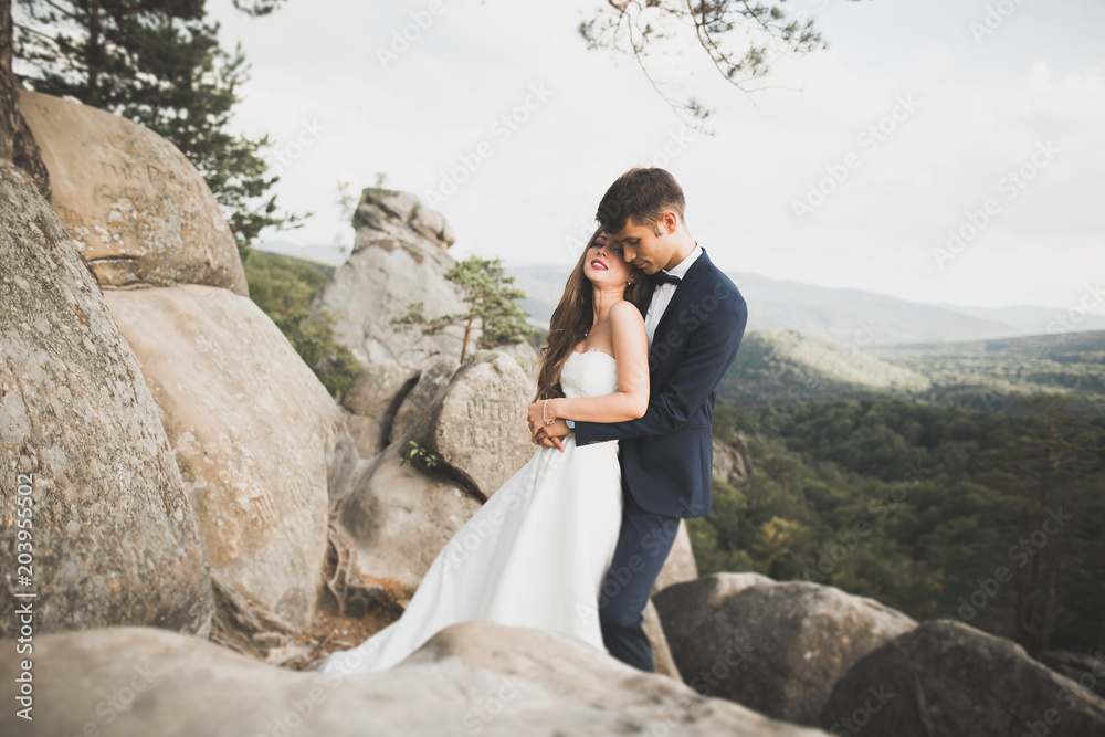 Sensual portrait of a young wedding couple. Outdoor