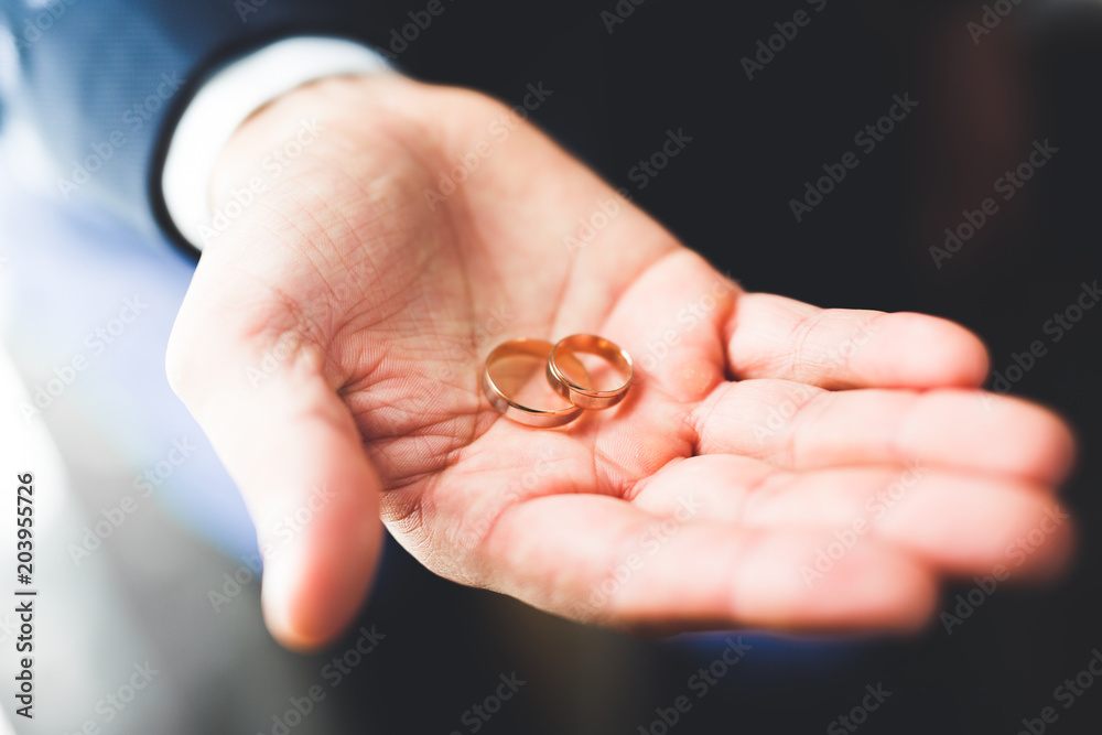 Newly wed couple's hands with wedding rings Newly wed couple's hands with wedding rings