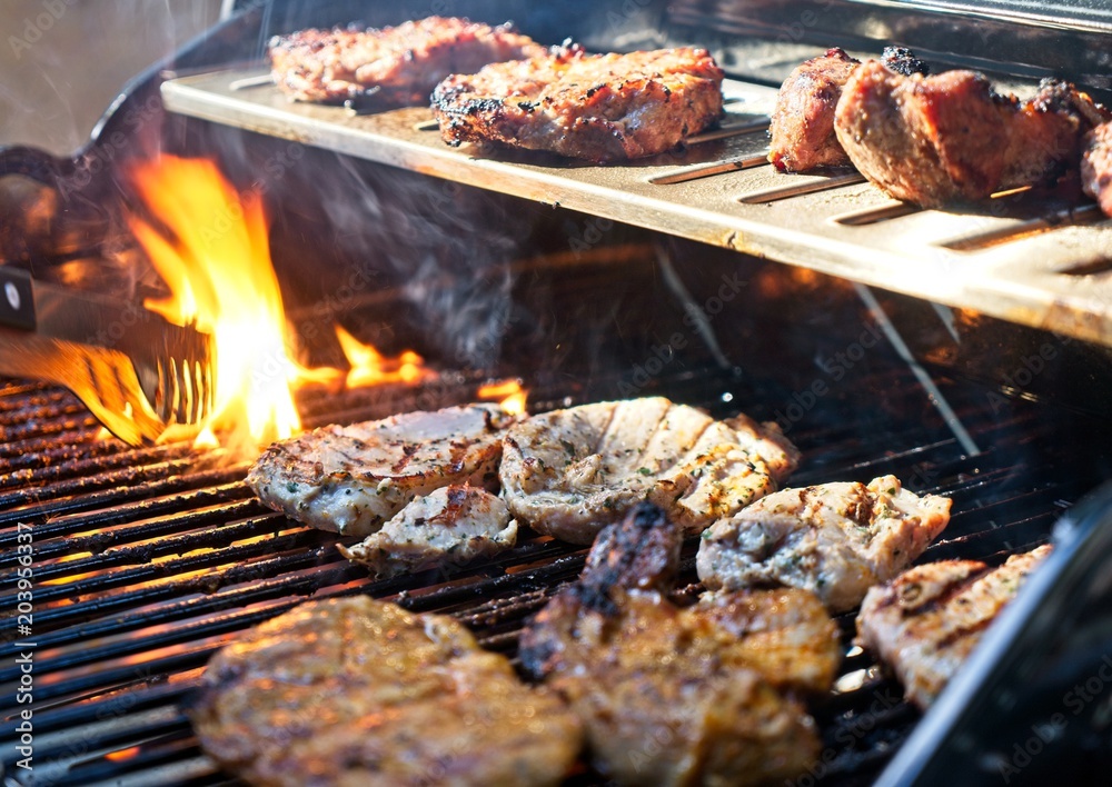 The meat is fried on the grill The meat is fried on the grill