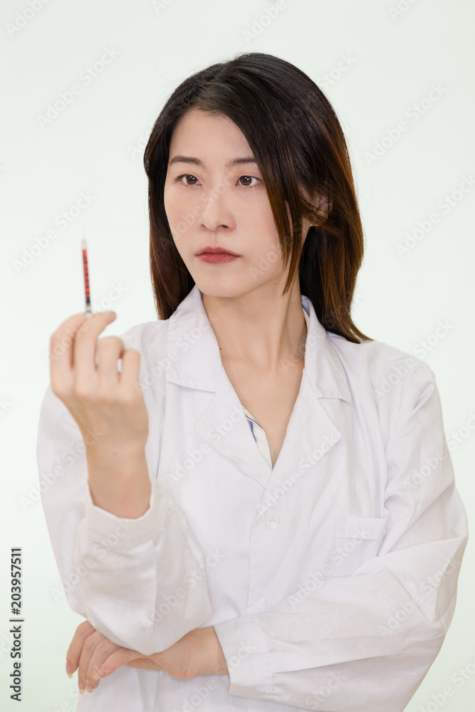 Asian nurse with blood-filled syringe Asian nurse with blood-filled syringe