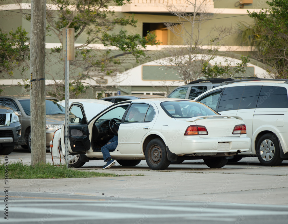 broken down car has unknown driver waiting for a tow truck and roadside assistance