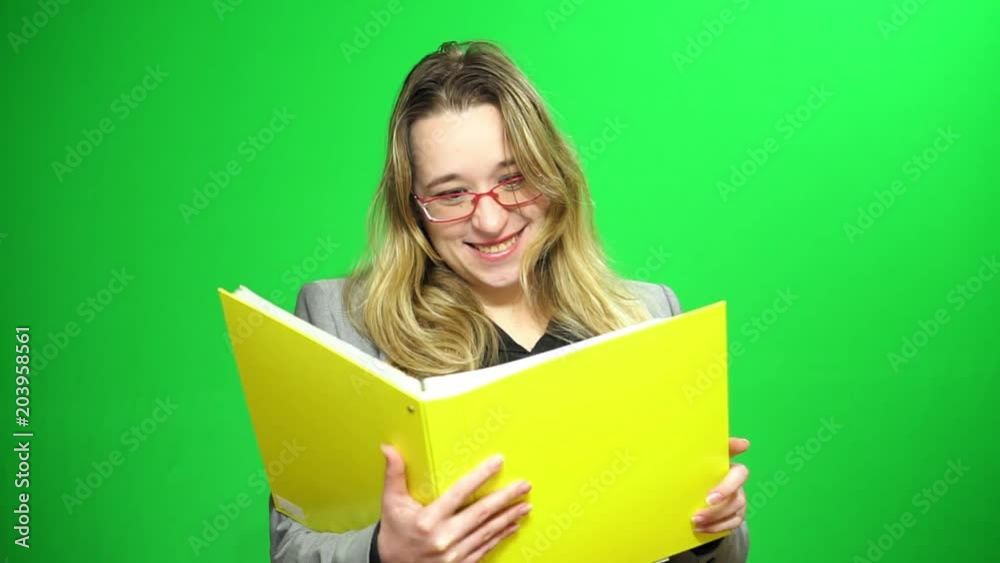 Office manager with a report folder. She studying records. Happy and agrees with the results. Green screen background. Office manager with a report folder. She studying records. Happy and agrees with the results. Green screen background.