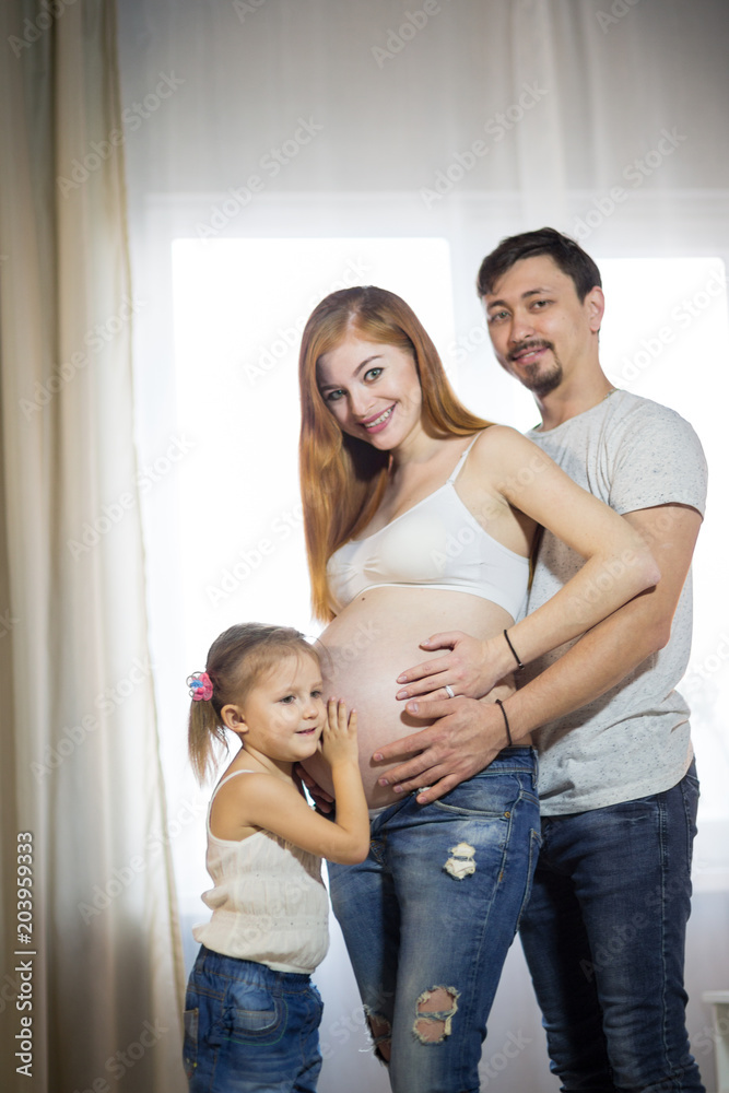 Family with a child and pregnant mother Family with a child and pregnant mother
