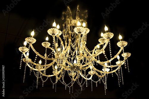  Crystal lamp.Glass chandelier isolated over black background.Closed up