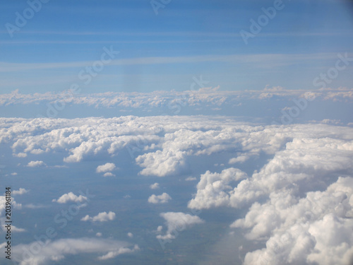 Blue sky with clouds, a view from airplane window