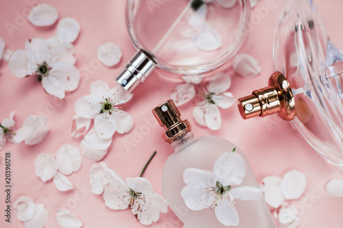 Perfume bottles pink background. Perfumery, cosmetics fragrance