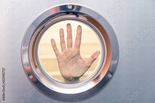 female hand in porthole