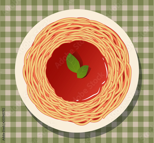Spaghetti with tomato sauce and basil leaves on a checkered tablecloth.