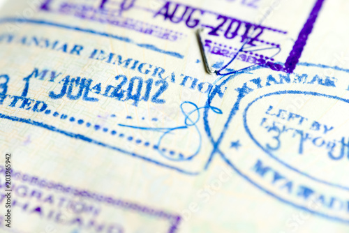 Asian countries visa stamps in passport, selective focus