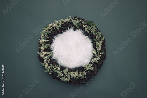 cozy fantasy nest with soft bedding and decorative white flowers on gray background