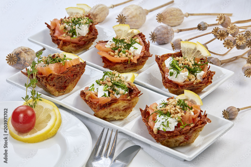 Salmon with cheese, pine nuts and lemon