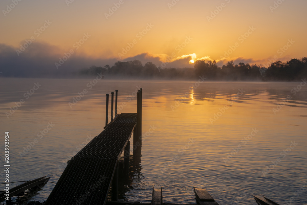 misty sunrise over a lake