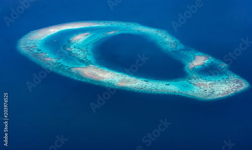Aerial view of an atoll in the Maldives, Indian Ocean photo