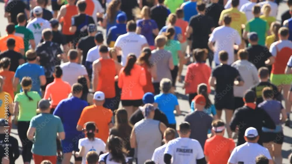 City marathon of people running in blurred