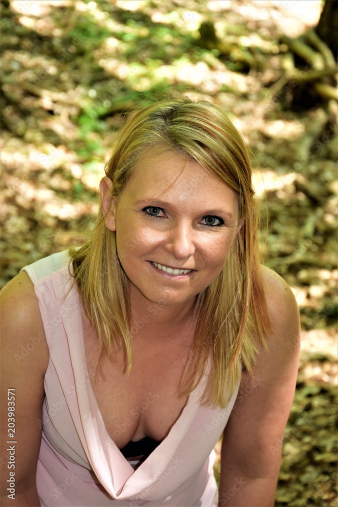 sexy blonde with a large cleavage bites his lips sexy blonde with a large cleavage bites his lips