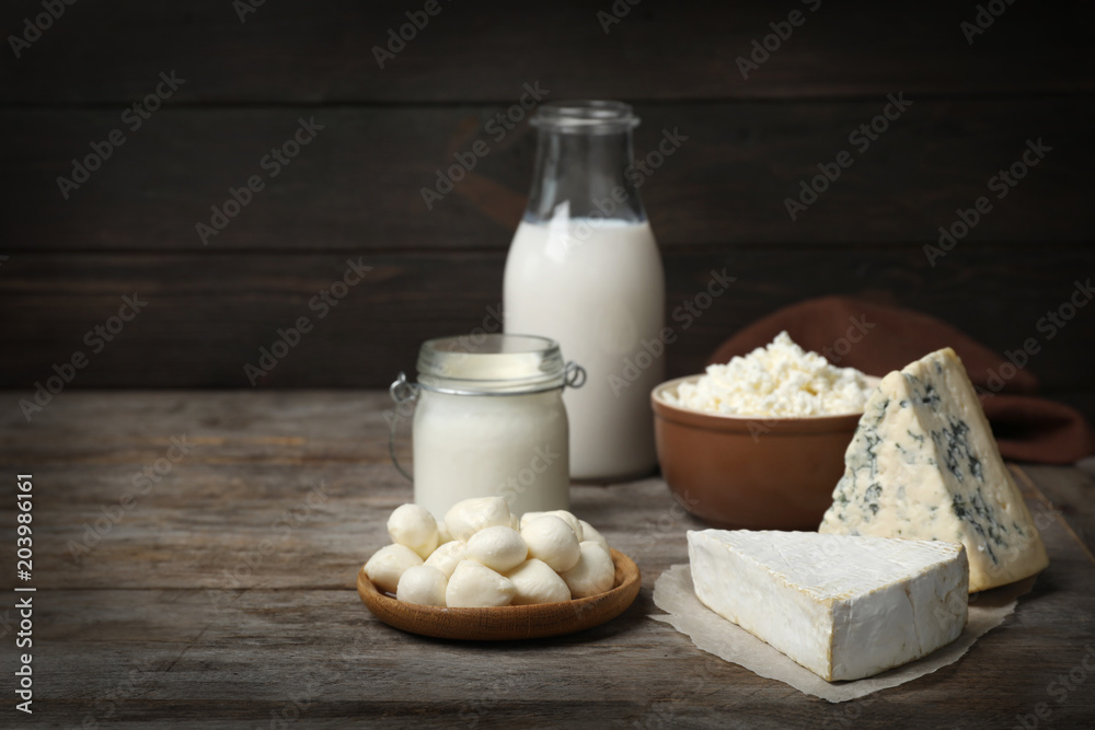 Different fresh dairy products on wooden table Different fresh dairy products on wooden table