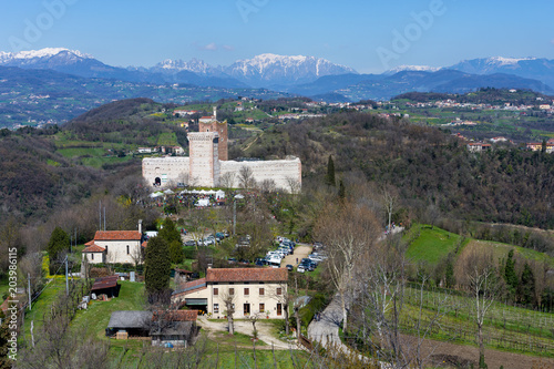 View of the "Castle of the Villa" also known as Romeo's Castle in Montecchio Maggiore with the background of the snow-capped Alps