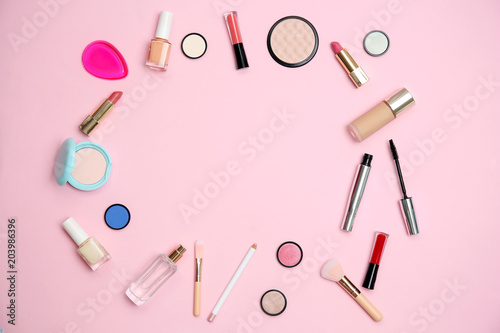 Flat lay composition with makeup products for woman on color background
