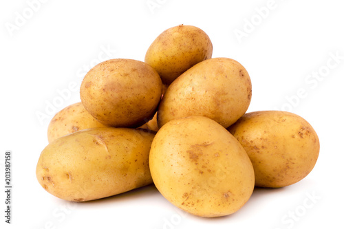 Bunch of potatoes on a white background, close up.