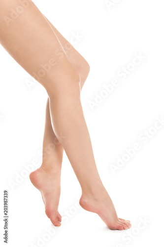 Young woman showing smooth silky skin after epilation on white background © New Africa