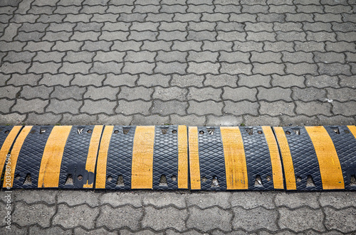 Photography Speed bump on a paved road.