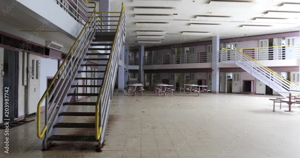 Pan across common room of prison