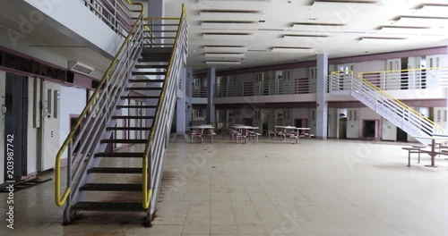 Pan across common room of prison