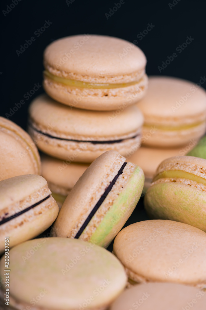 Many colored sweet macaroons cookie. Can be used as a background. Selective focus Many colored sweet macaroons cookie. Can be used as a background. Selective focus
