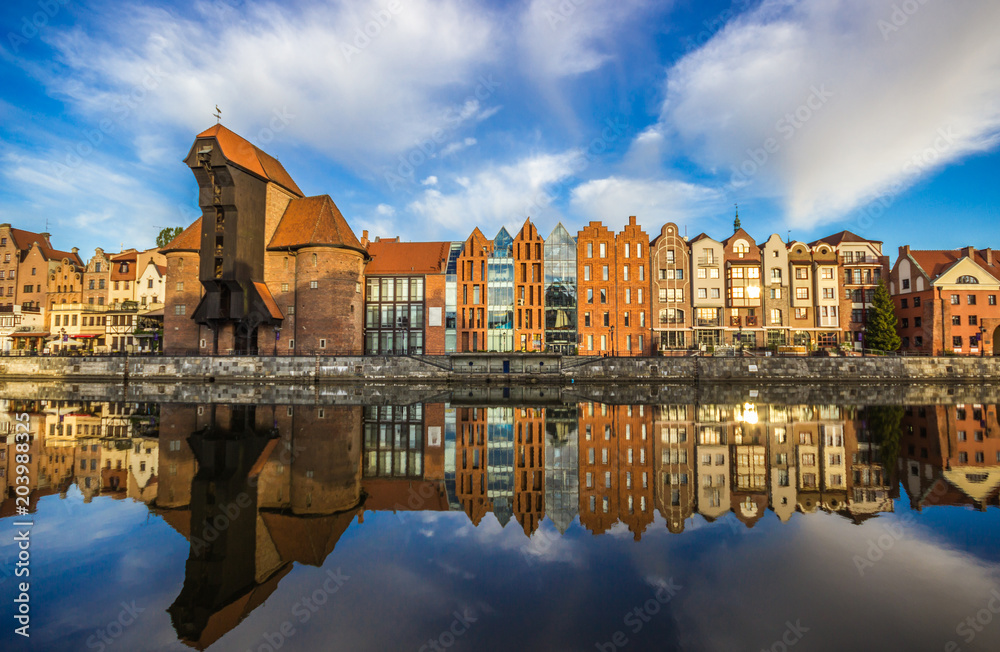 Amazing sunrise. Old town of Gdansk at Motlawa river, Poland