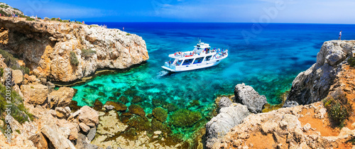 Amazing sea and rocks formation in Cyprus. Boat trips in  Natural park Cape Greko photo