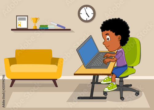 little boy using laptop in living room