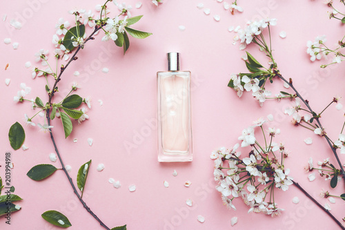 Floral perfume bottle with orchid flowers photo