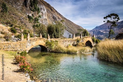 Old colonial bridge in the Yayus National Reserve. The Yauyos reserve in Peru is a pure hidden jewel. Most of the villages are abandoned and only a handful of people are still living there. photo
