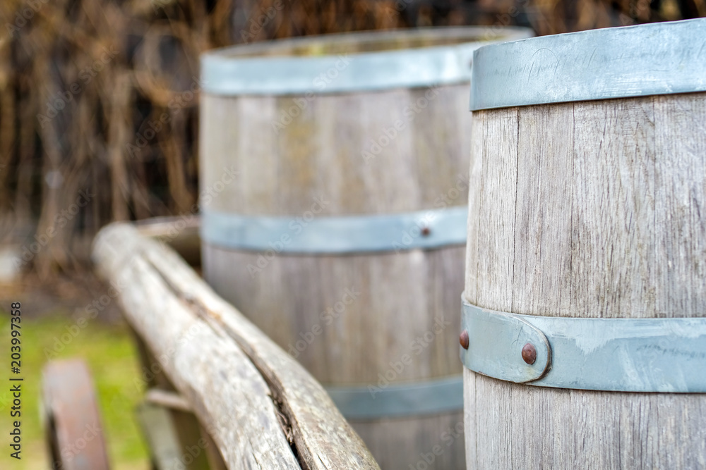 Close-up of barrels for transporting goods on antique cart with three Close-up of barrels for transporting goods on antique cart with three